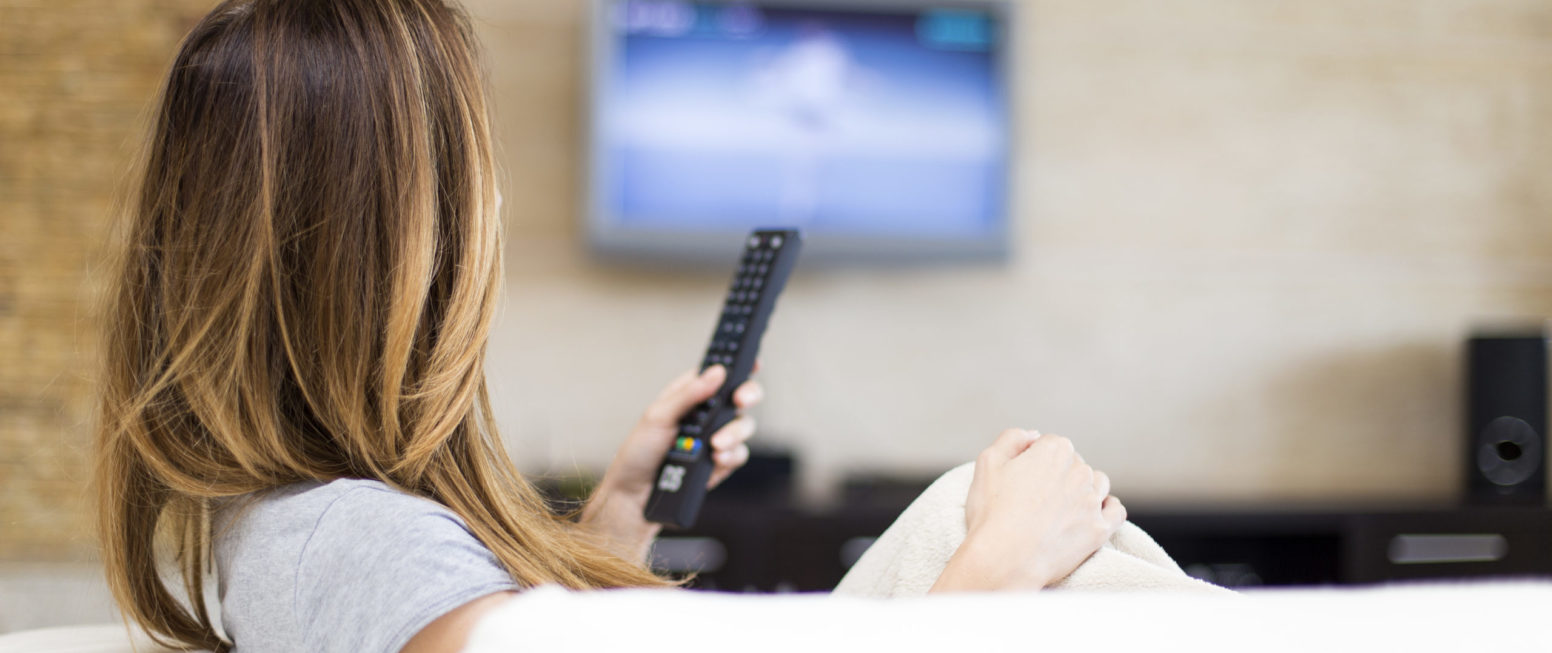 young woman watching tv